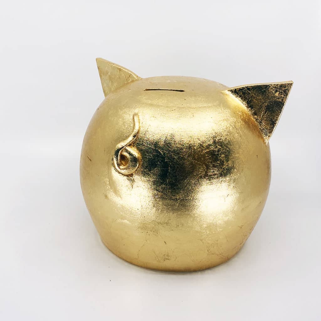 Golden piggy bank for decor & savings inspiration.