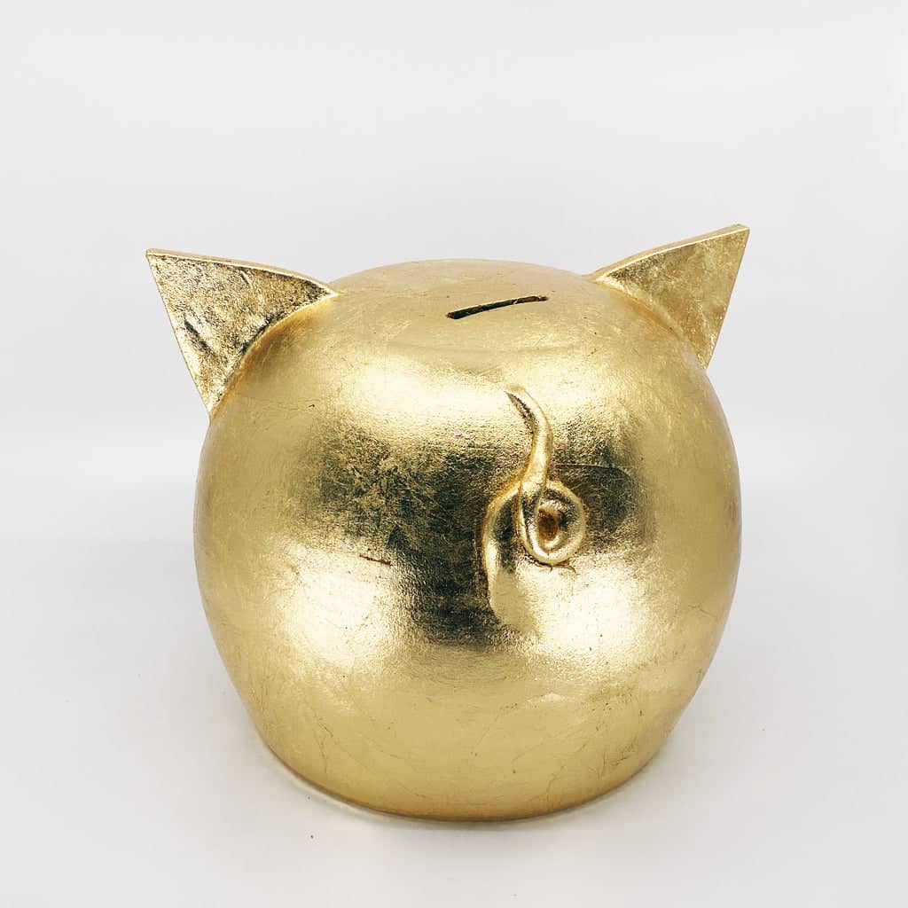 Golden piggy bank for decor & savings inspiration.