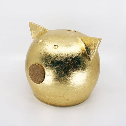 Golden piggy bank for decor & savings inspiration.