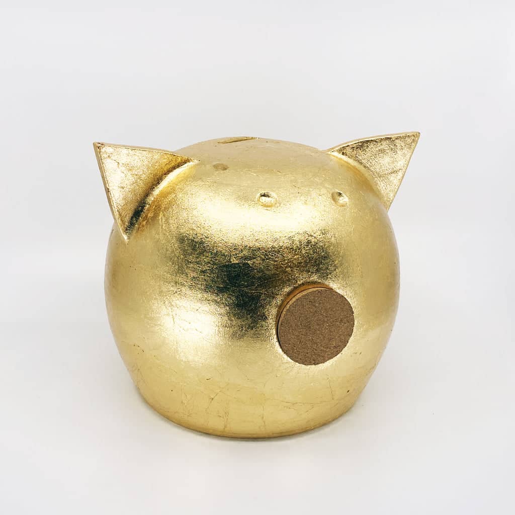 Golden piggy bank for decor & savings inspiration.