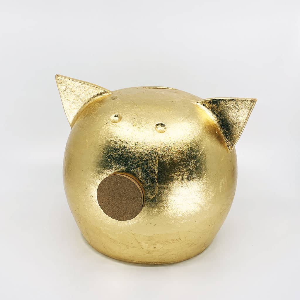 Golden piggy bank for decor & savings inspiration.