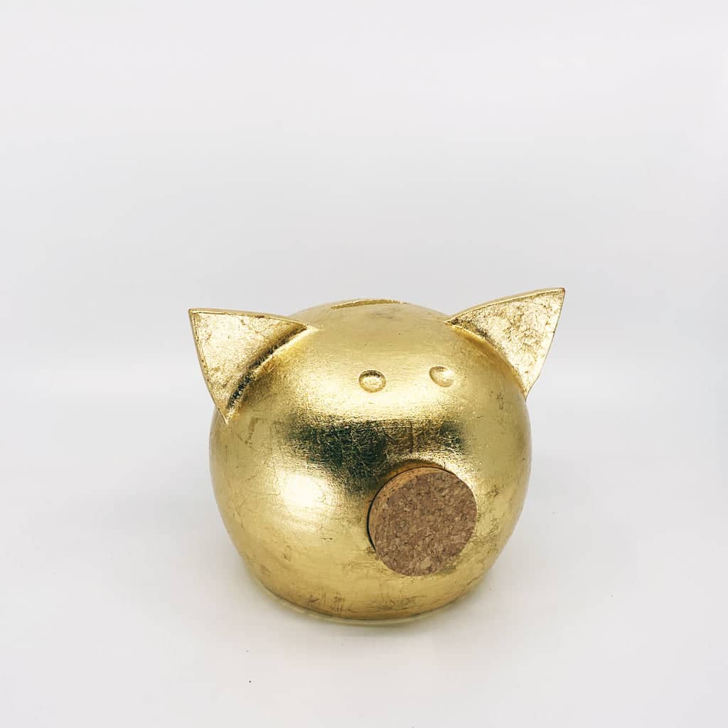 Golden piggy bank for decor & savings inspiration.