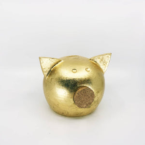 Golden piggy bank for decor & savings inspiration.