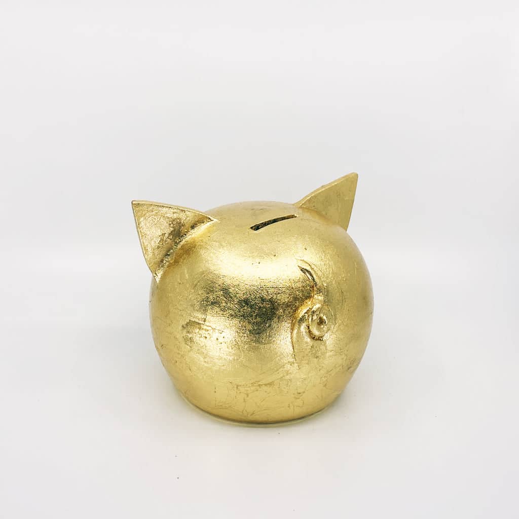 Golden piggy bank for decor & savings inspiration.