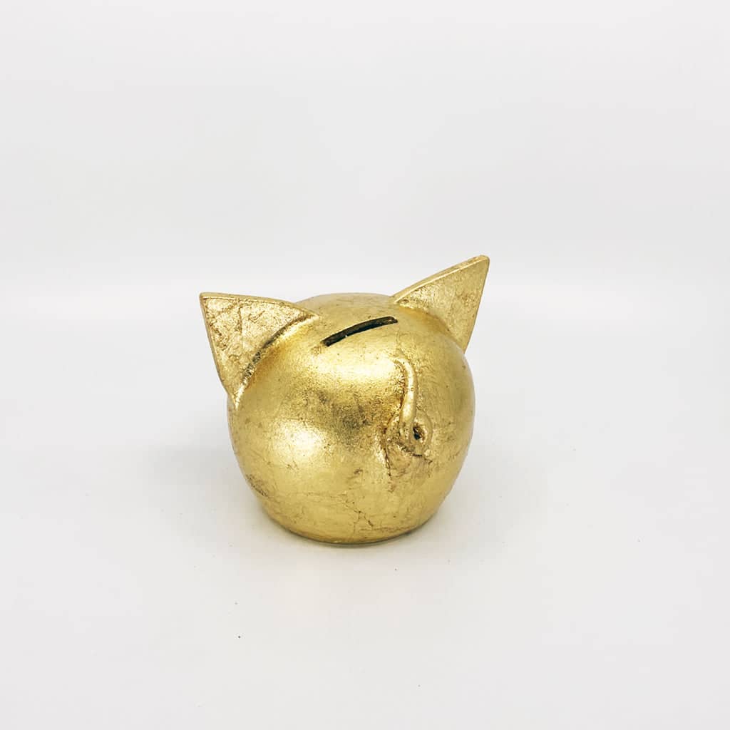 Golden piggy bank for decor & savings inspiration.