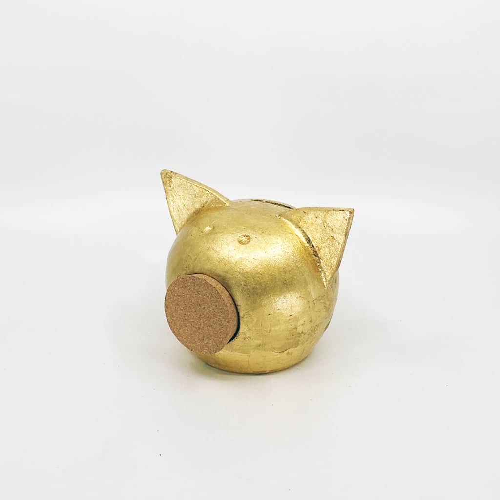 Golden piggy bank for decor & savings inspiration.