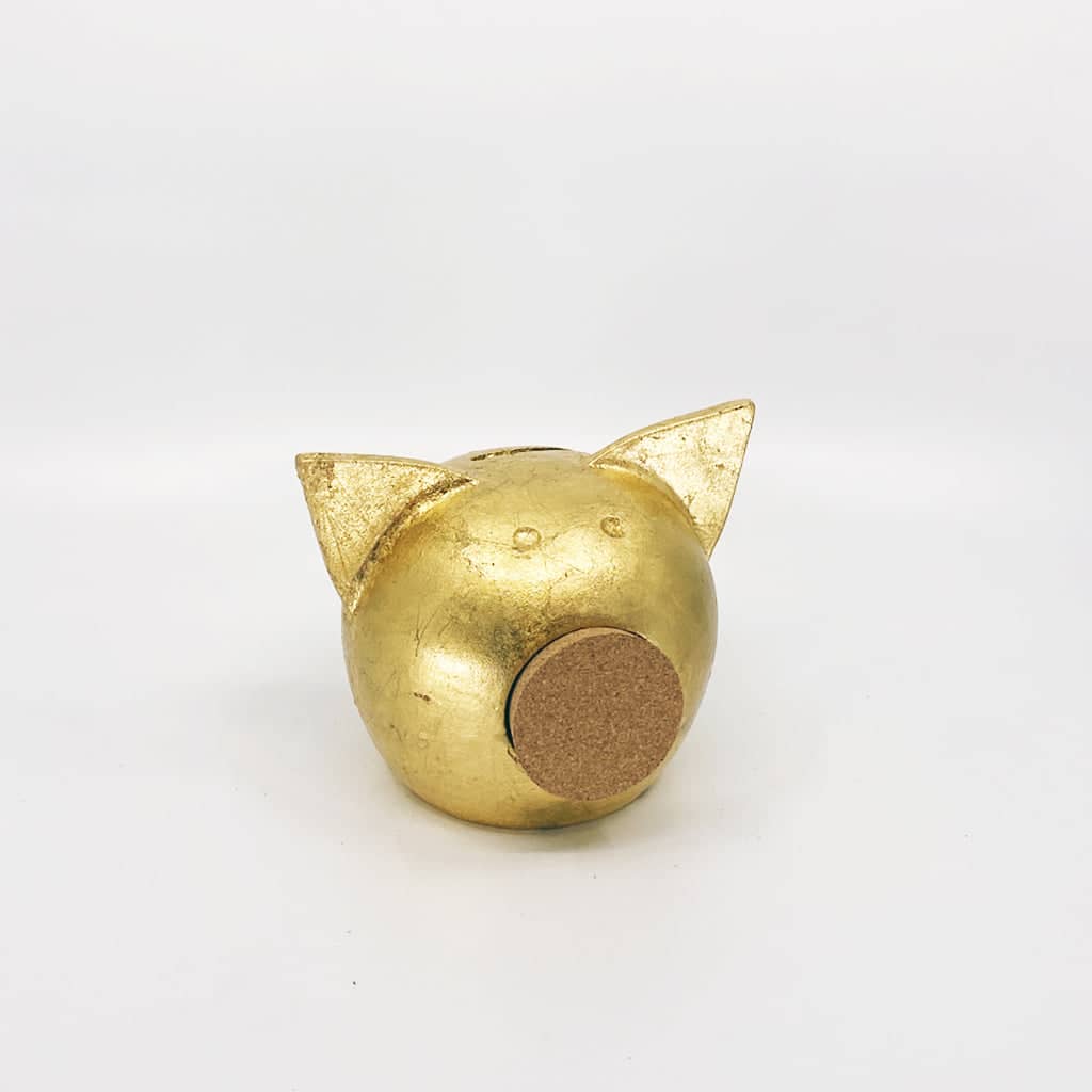 Golden piggy bank for decor & savings inspiration.