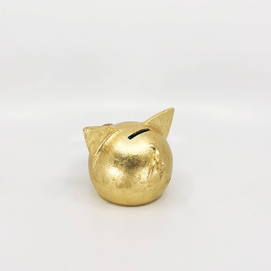 Golden piggy bank for decor & savings inspiration.