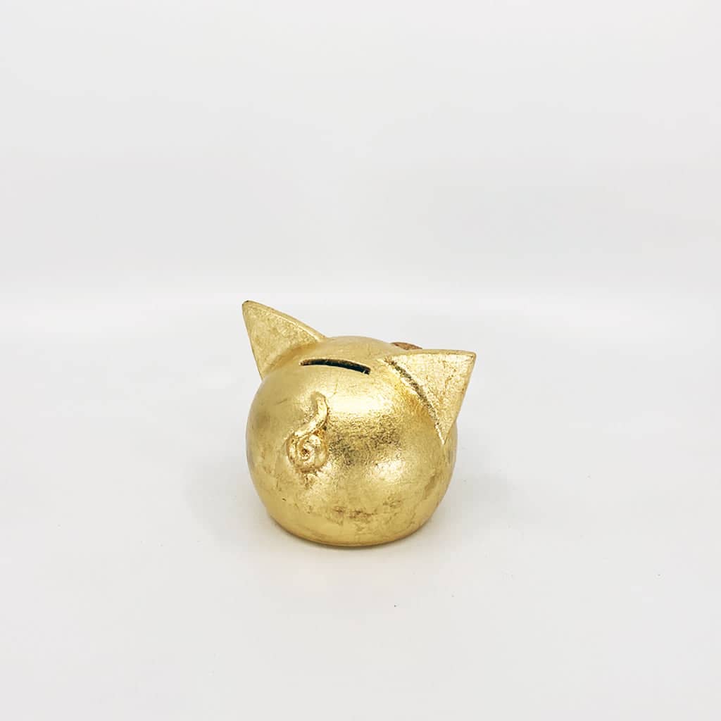 Golden piggy bank for decor & savings inspiration.