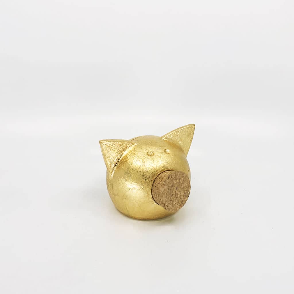 Golden piggy bank for decor & savings inspiration.