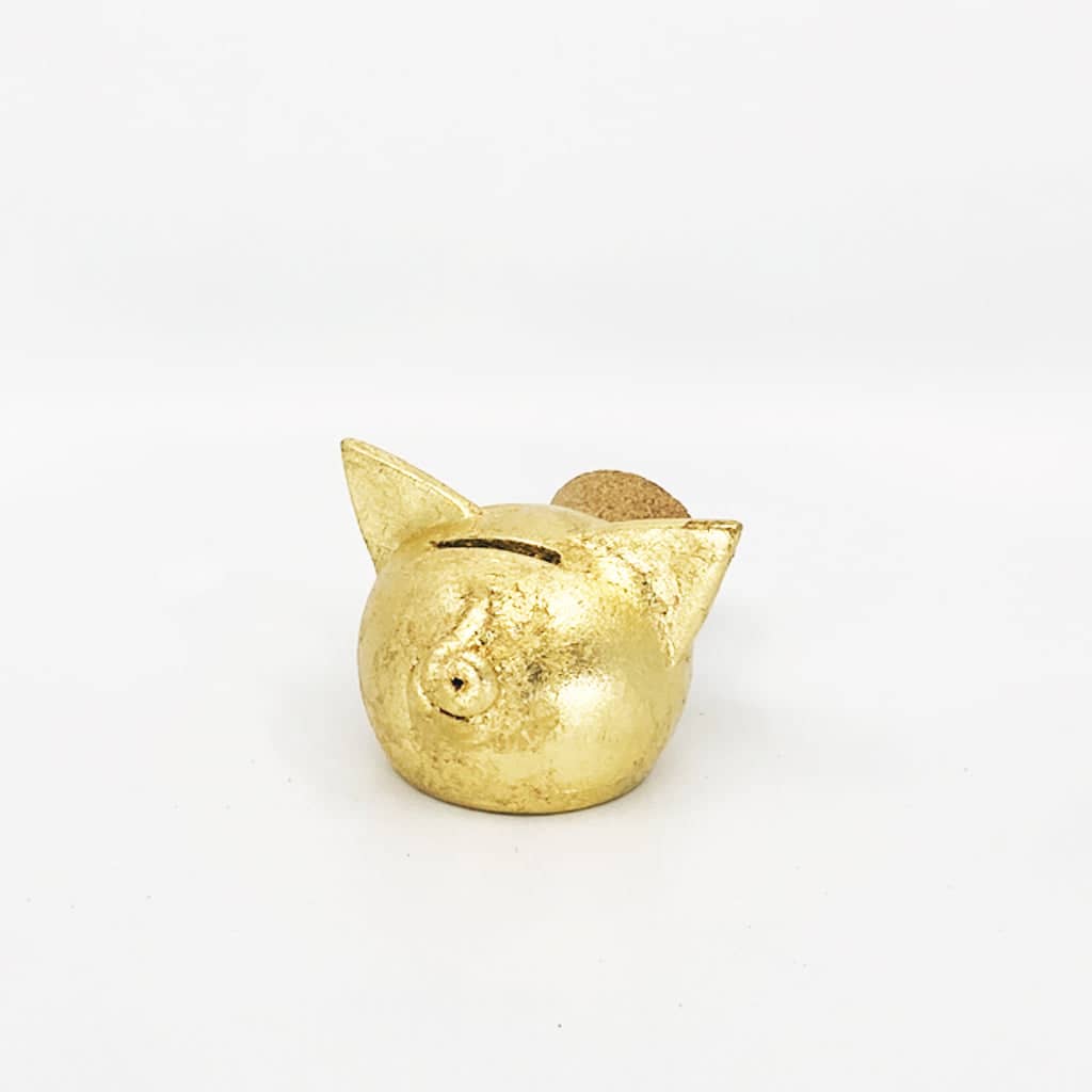 Golden piggy bank for decor & savings inspiration.