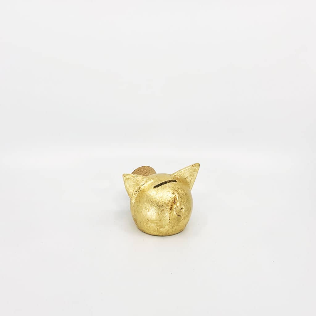 Golden piggy bank for decor & savings inspiration.