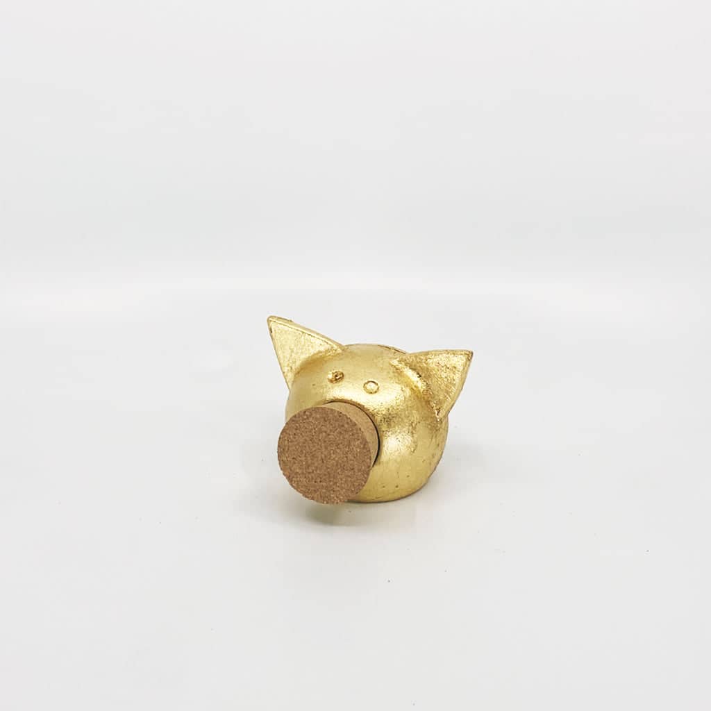 Golden piggy bank for decor & savings inspiration.