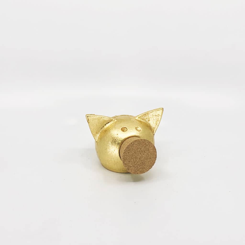 Golden piggy bank for decor & savings inspiration.